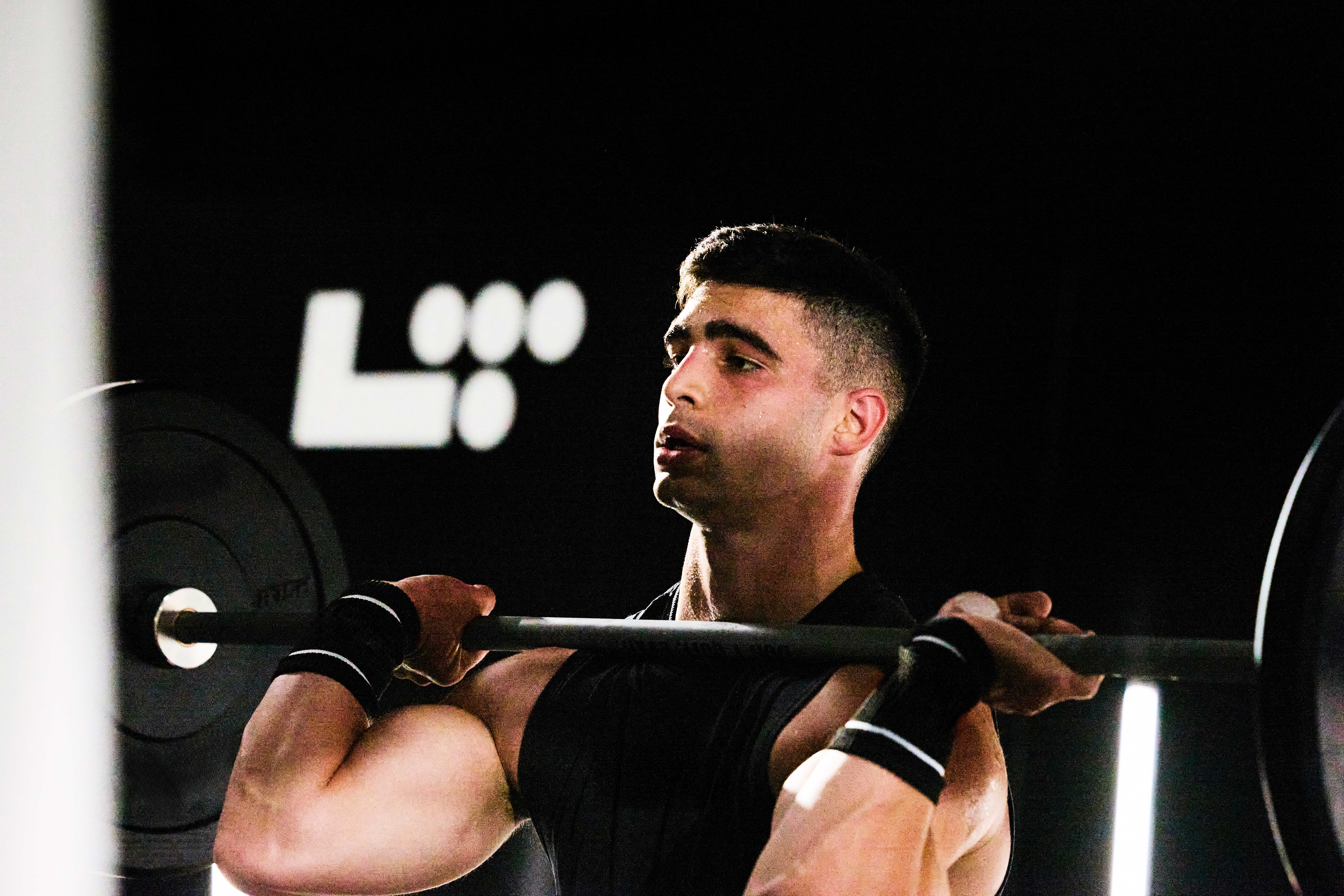 man resting a barbell on his chest