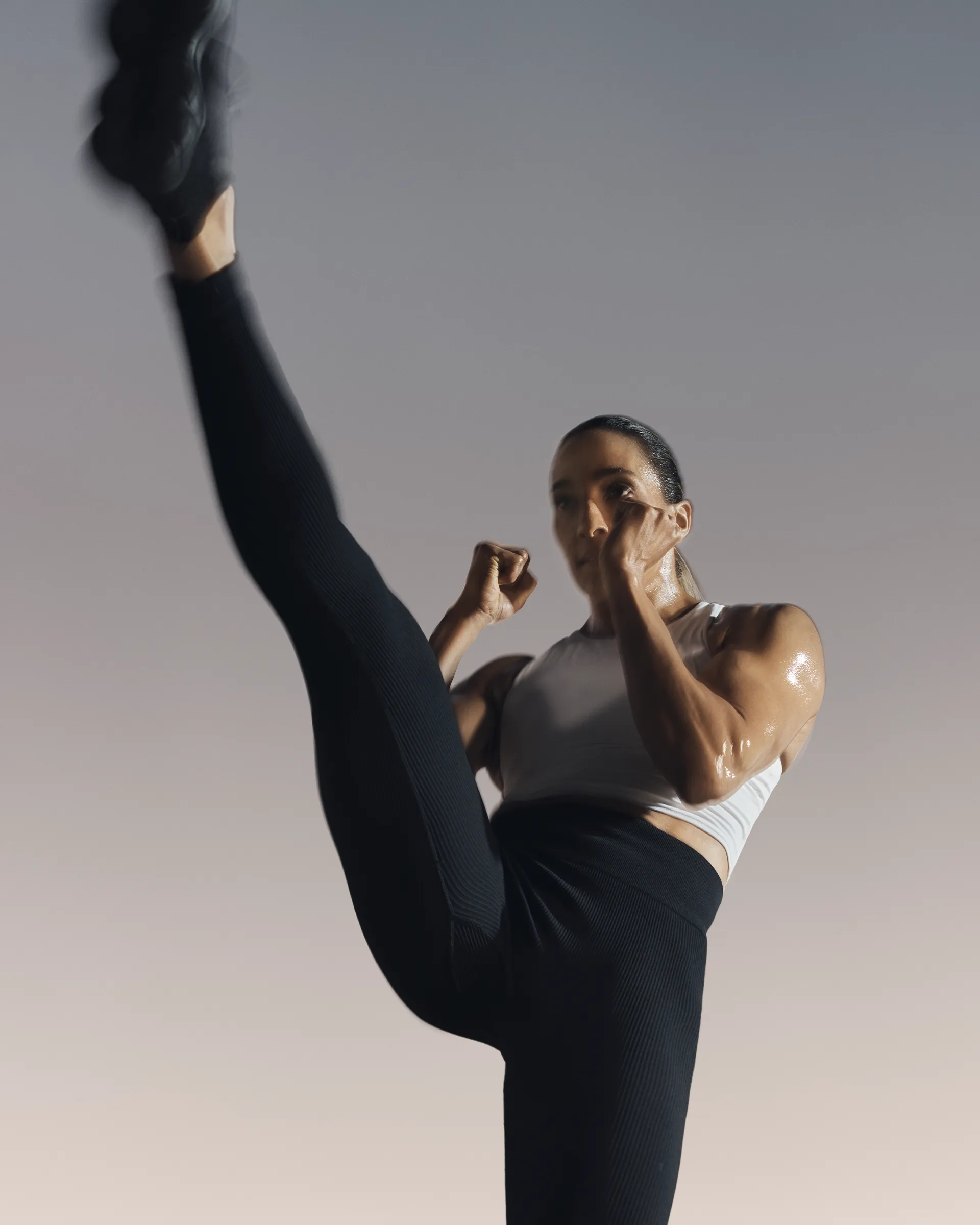 Strike kickboxing martial arts class participant using a jump rope at Life Time