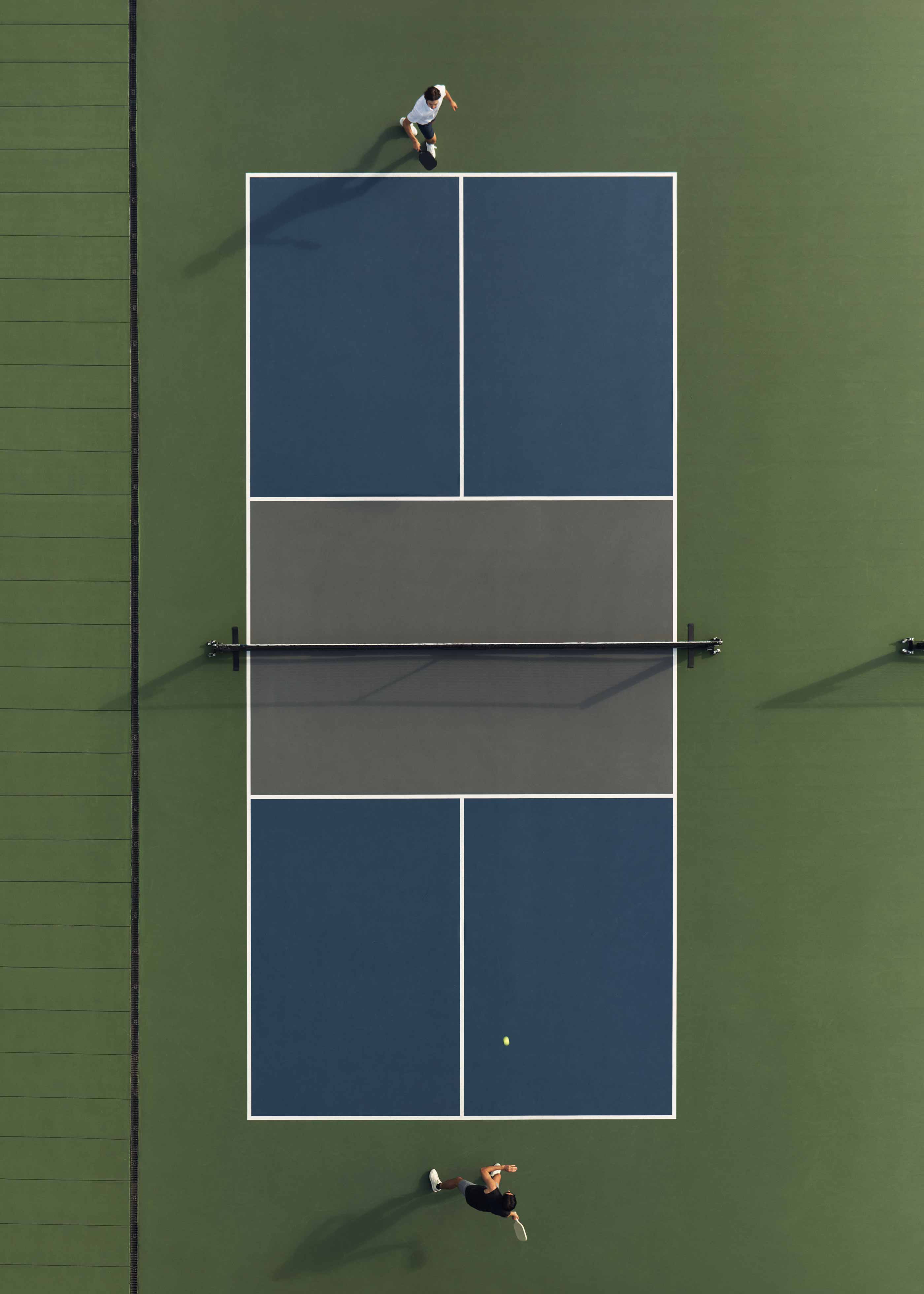 Aerial view of a doubles pickleball match on a Life Time court