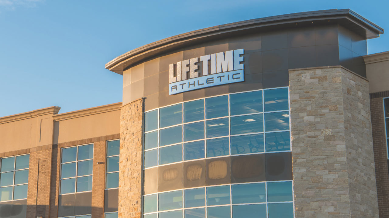 The close up of the Life Time sign on a Life Time building