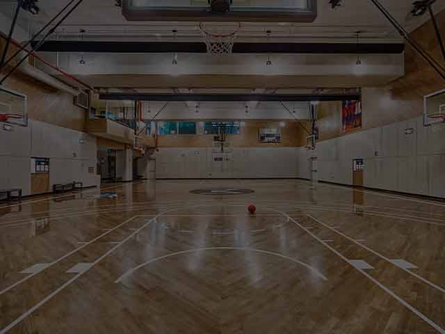 An image of a basketball court at a Life Time facility