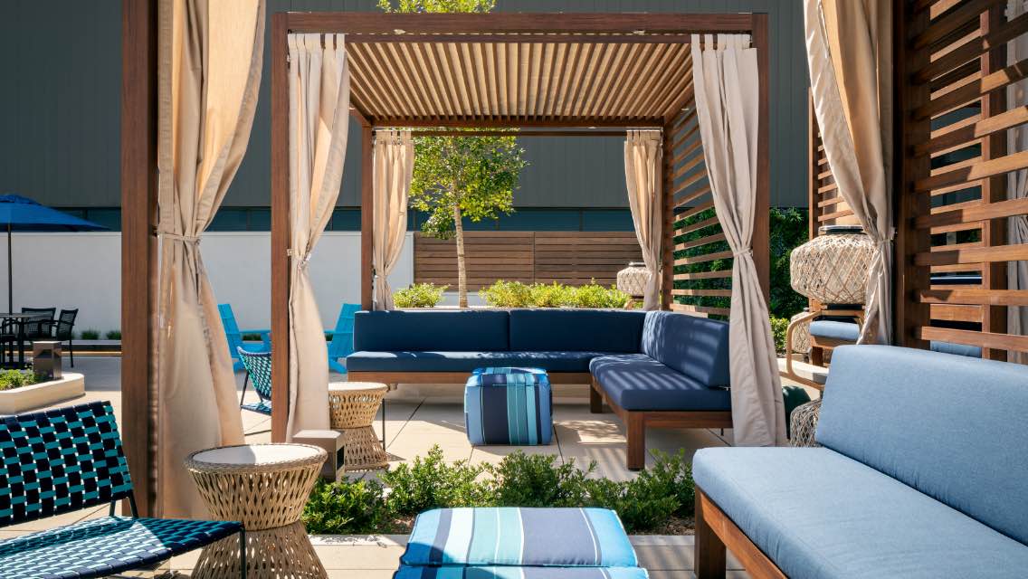 Spacious, luxurious poolside cabana at Life Time outdoor pool