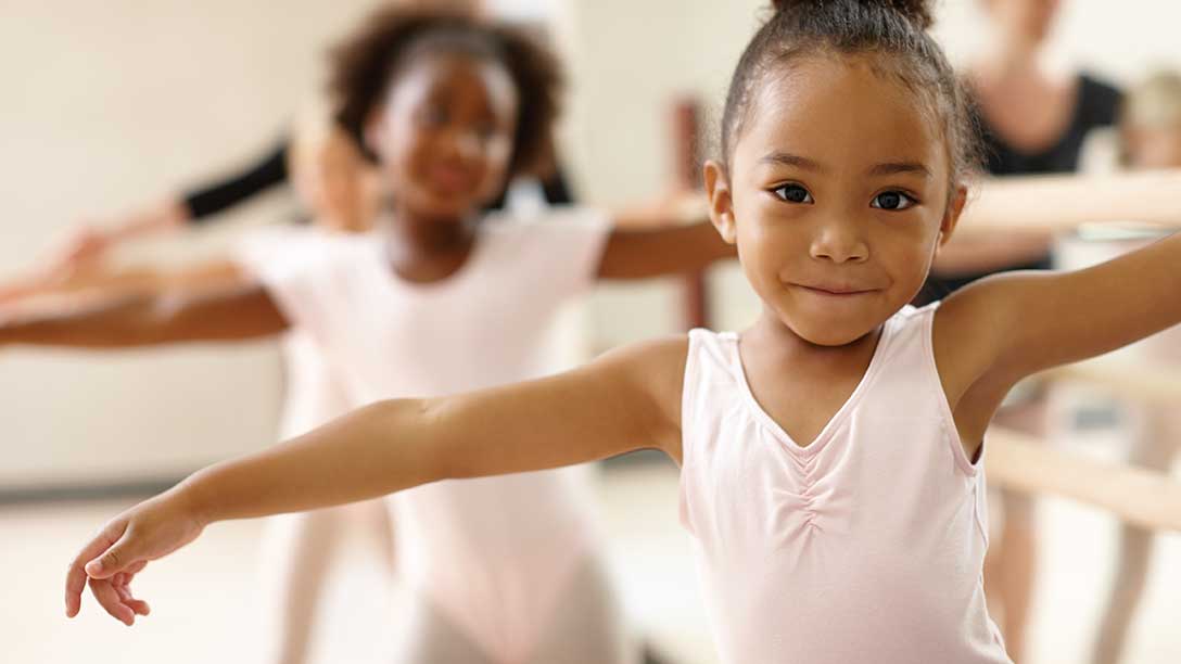 Young girl does ballet in a class