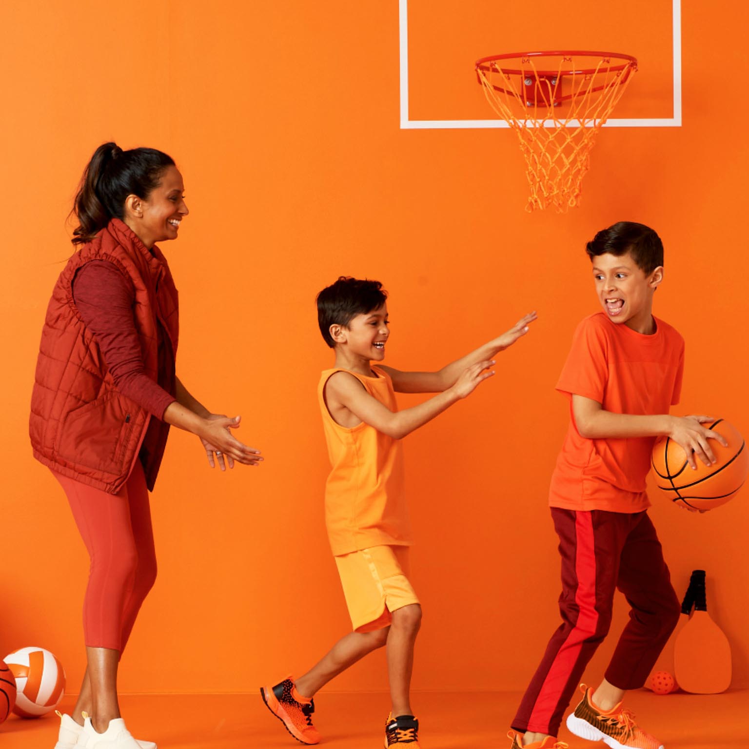 a family playing basketball together