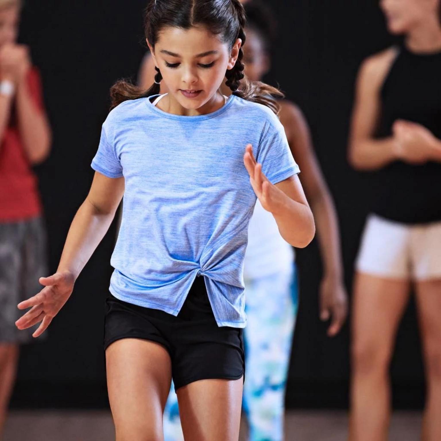 A young girl practicing footwork drills