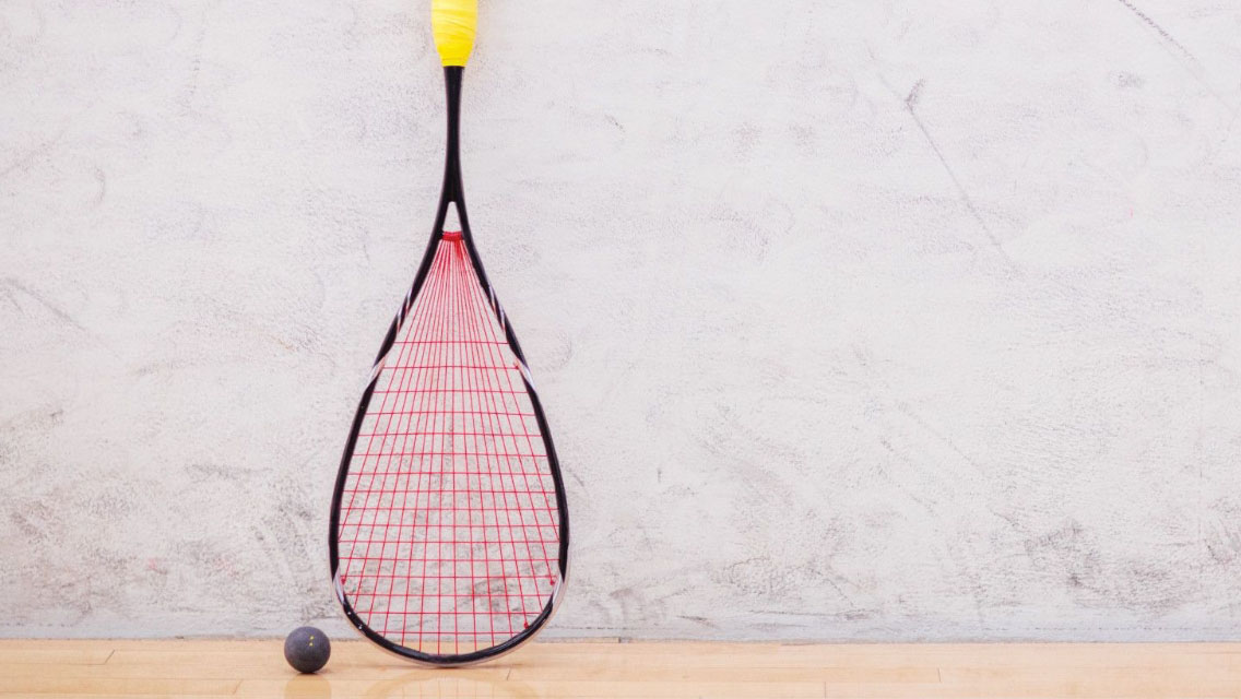 a squash racquet and squash ball