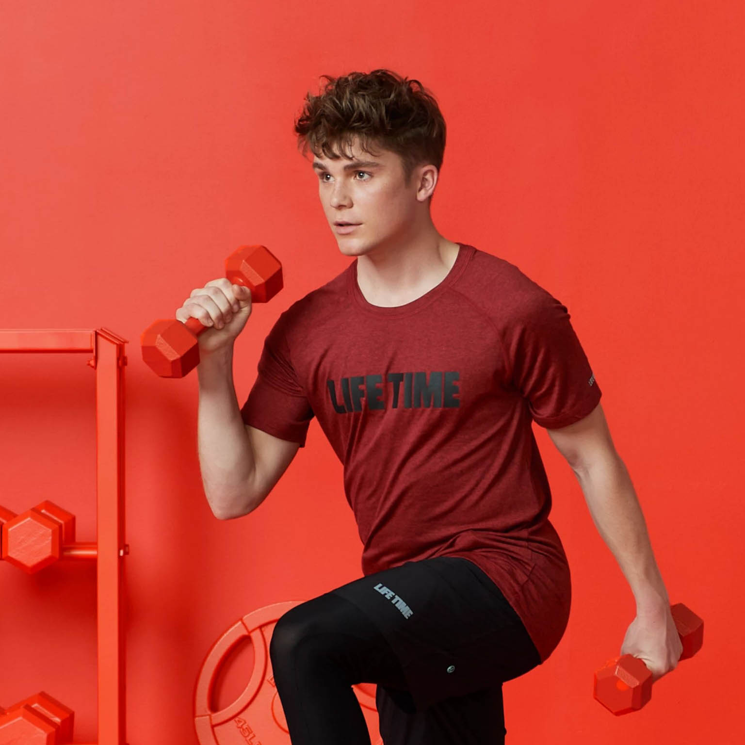 a teenage boy working out with weights