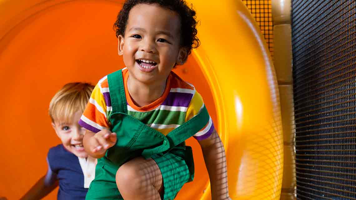 Kids playing in Life Time play area