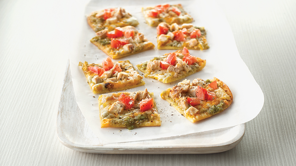 A chicken and tomato flatbread pizza