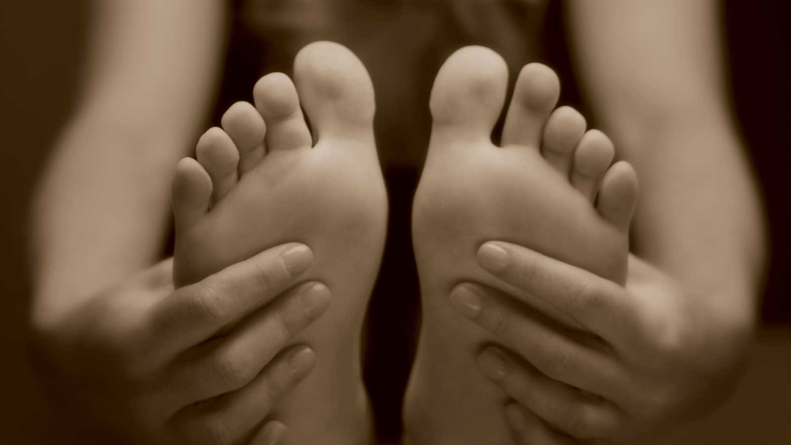 A woman's feet and hands, with manicure and pedicure