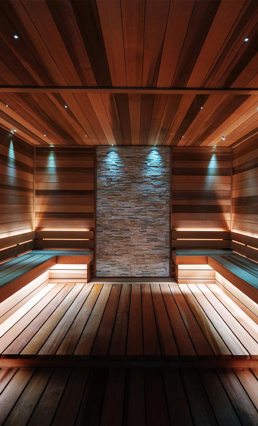 the inside of a cedar wood and stone sauna
