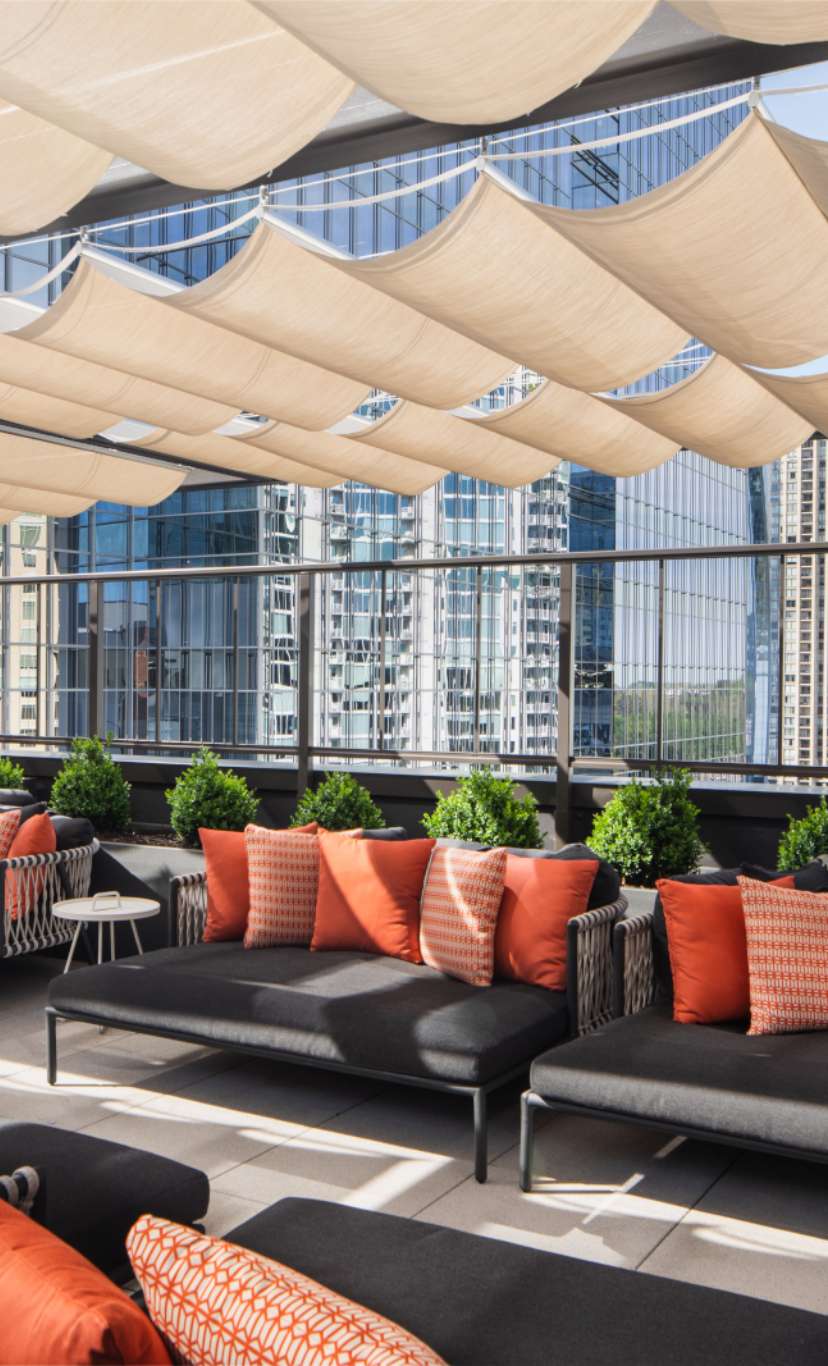 outdoor cabanas on rooftop of Life Time