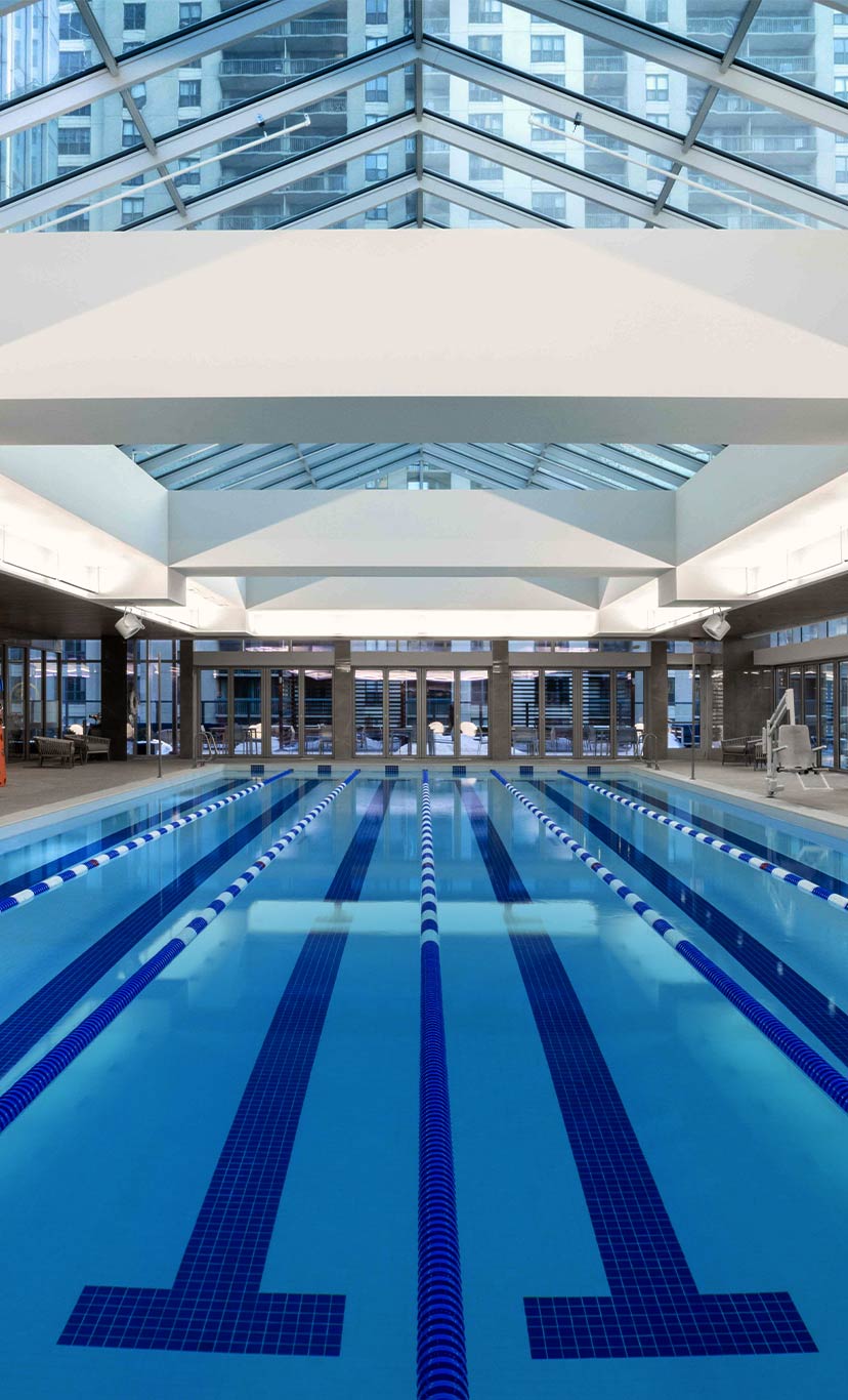 6 lane indoor lap pool with ceiling windows above