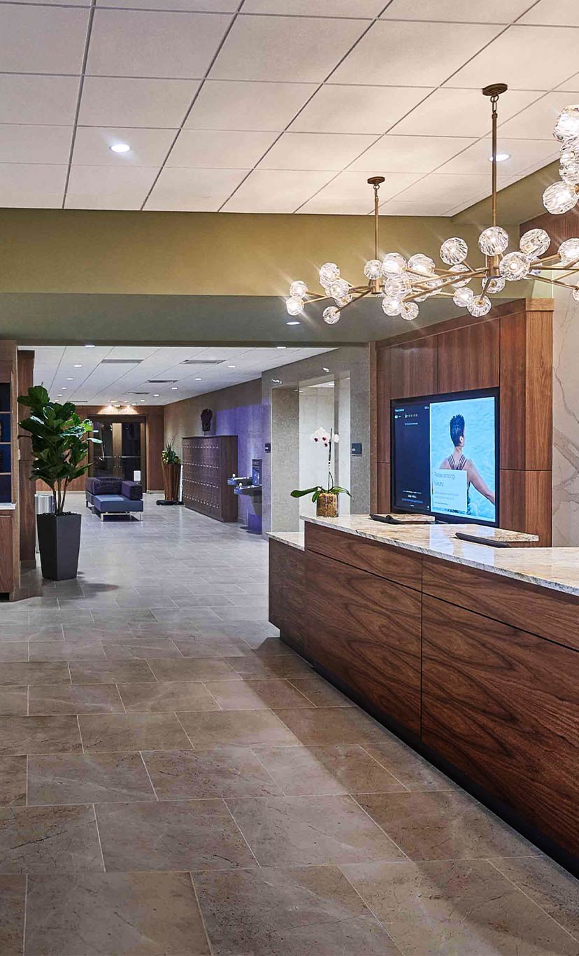 the welcome desk and hallways inside Life Time Riverside