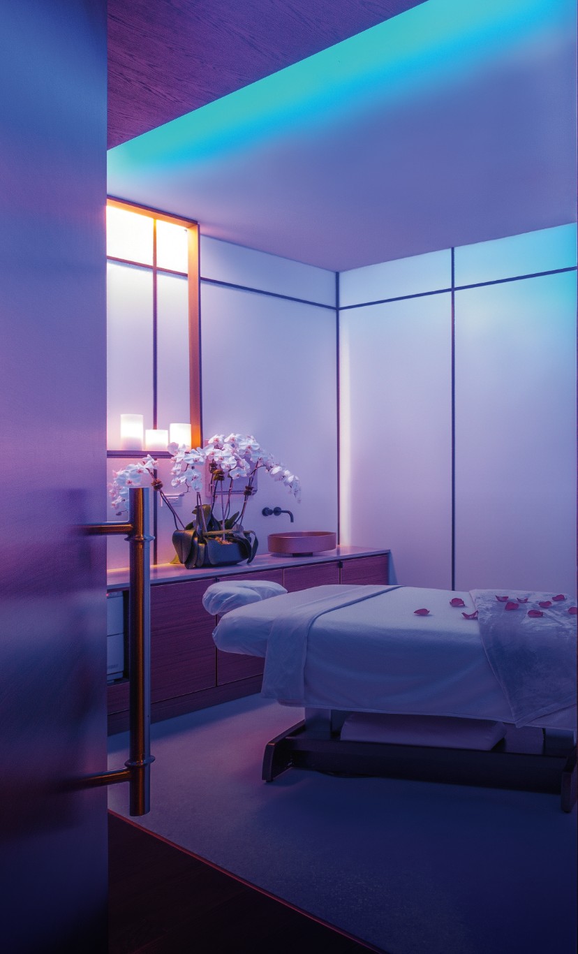 a lavendar lit massage room