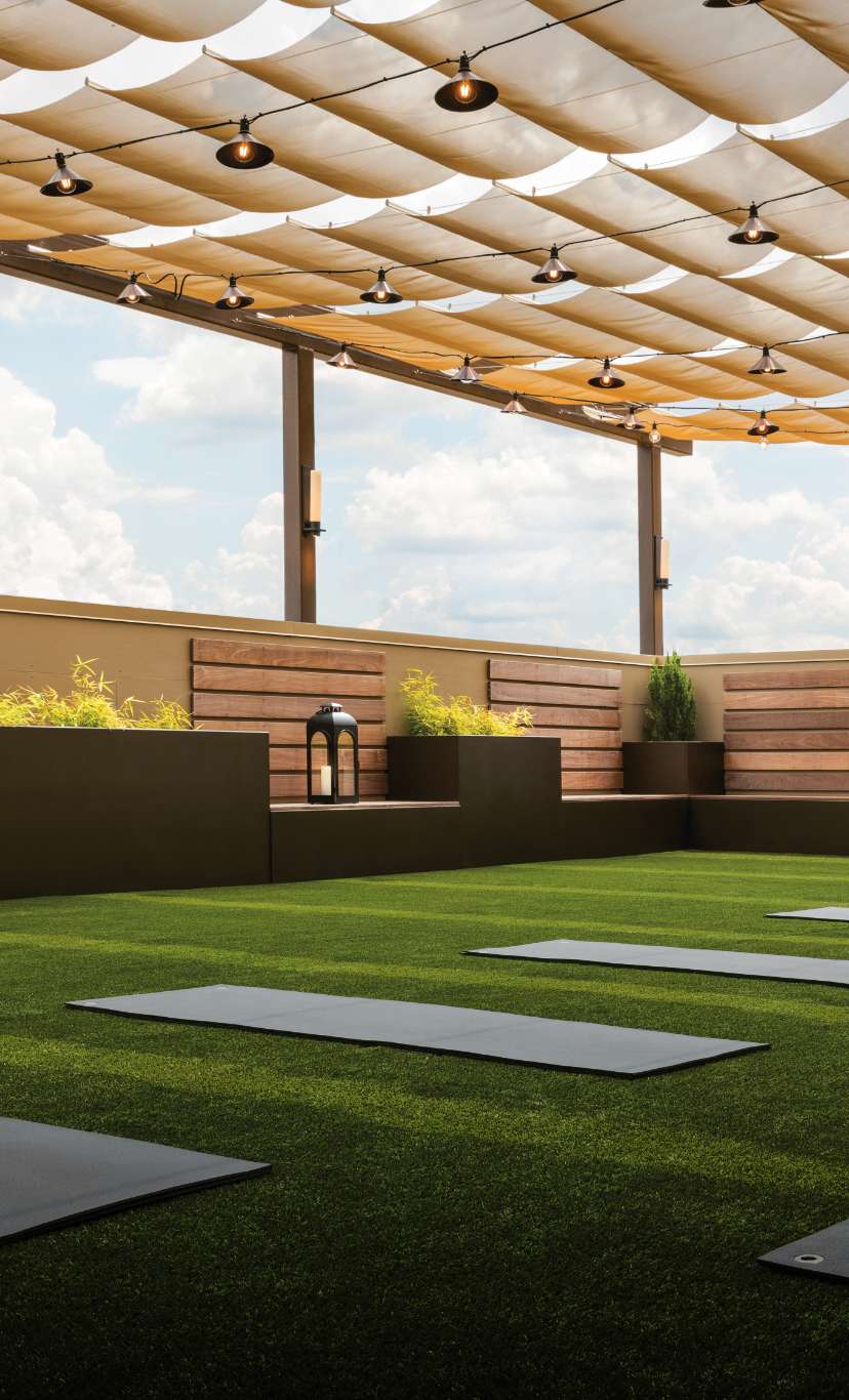 yoga mats laid out in an outdoor turf area