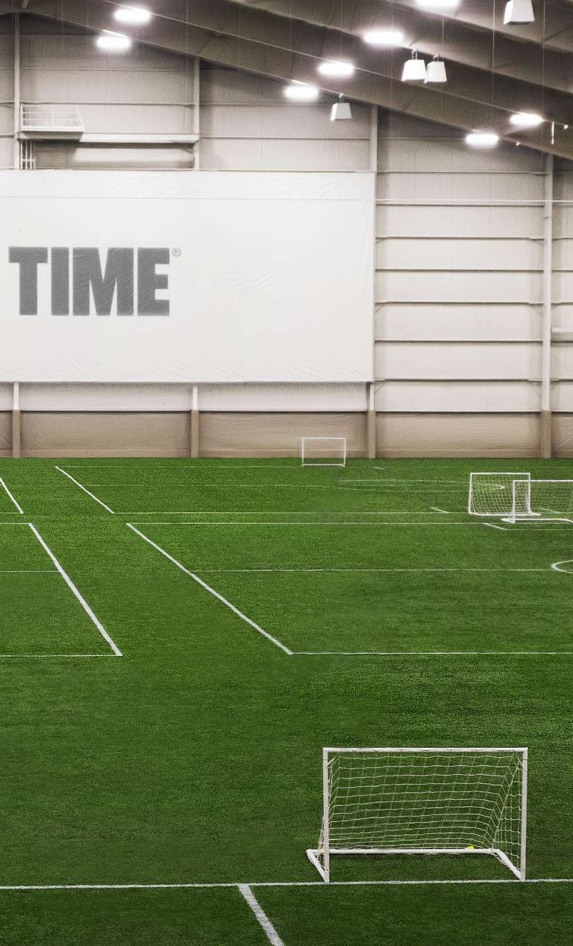 an indoor turf field for training and soccer