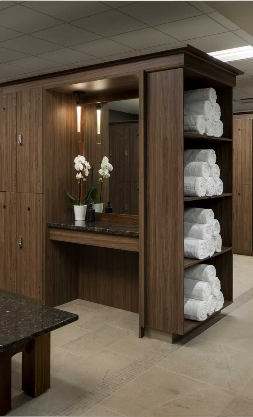 a white towel sits folded inside a luxurious locker room at Life Time