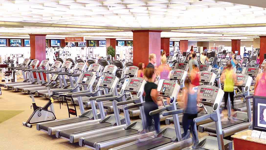 Members using fitness equipment in the club