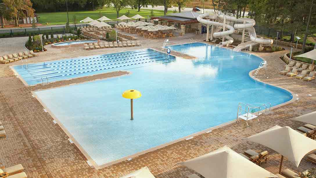 An aerial view of an outdoor pool and water slides