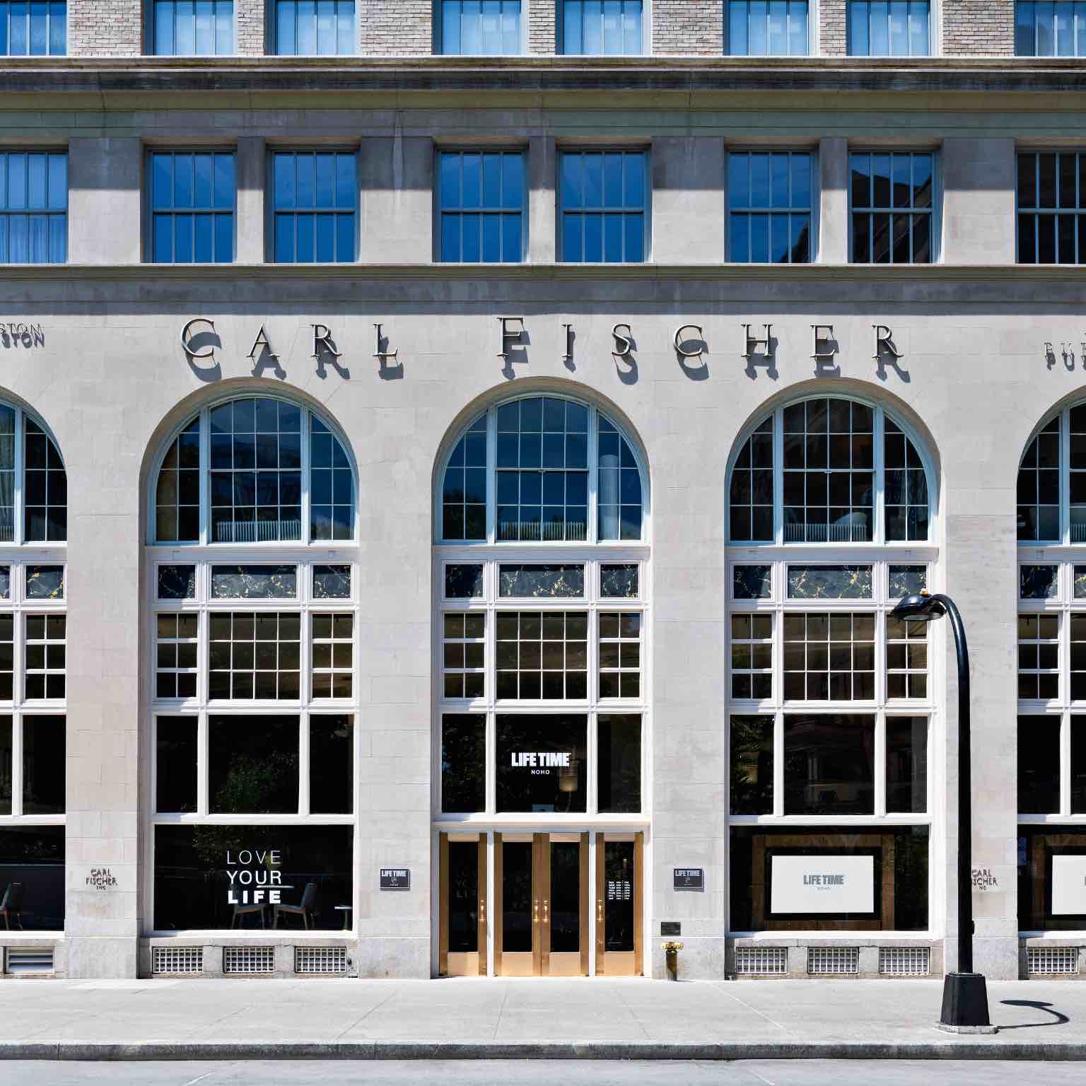 The exterior of the Carl Fischer Building and Life Time NoHo Enterance