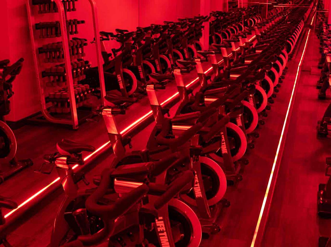 Indoor cycle studio at Life Time Battery Park