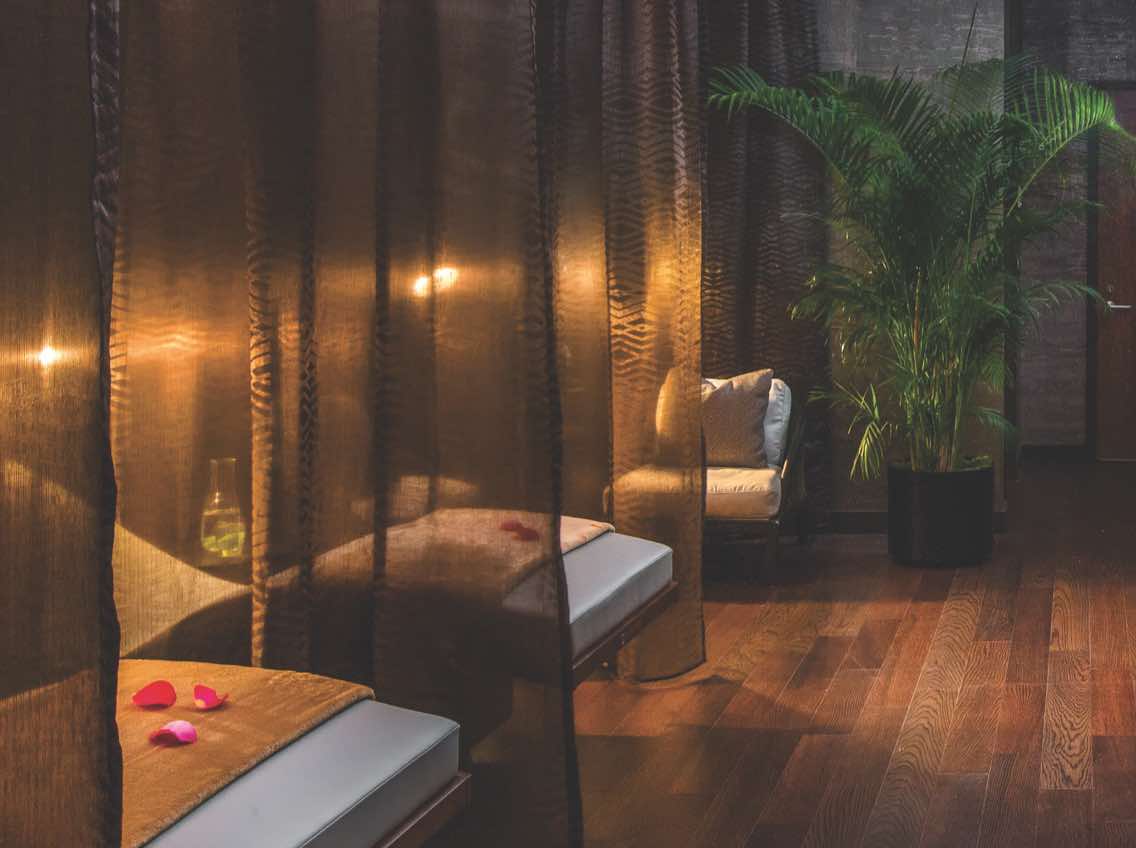 Peaceful, candle-lit massage room at LifeSpa