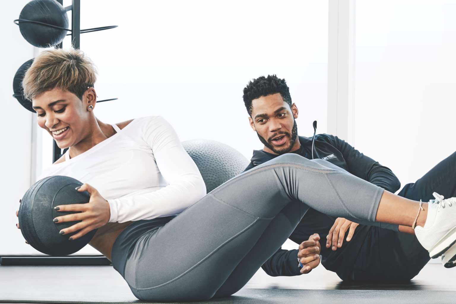 Personal trainer and a woman at Life Time