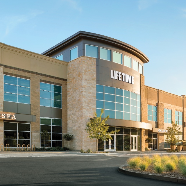 Life Time building exterior with blue sky background.