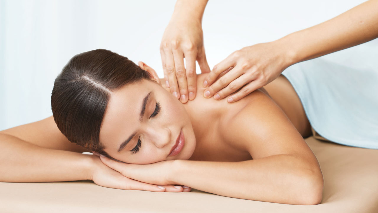 A woman getting a masage at the Life Time Spa