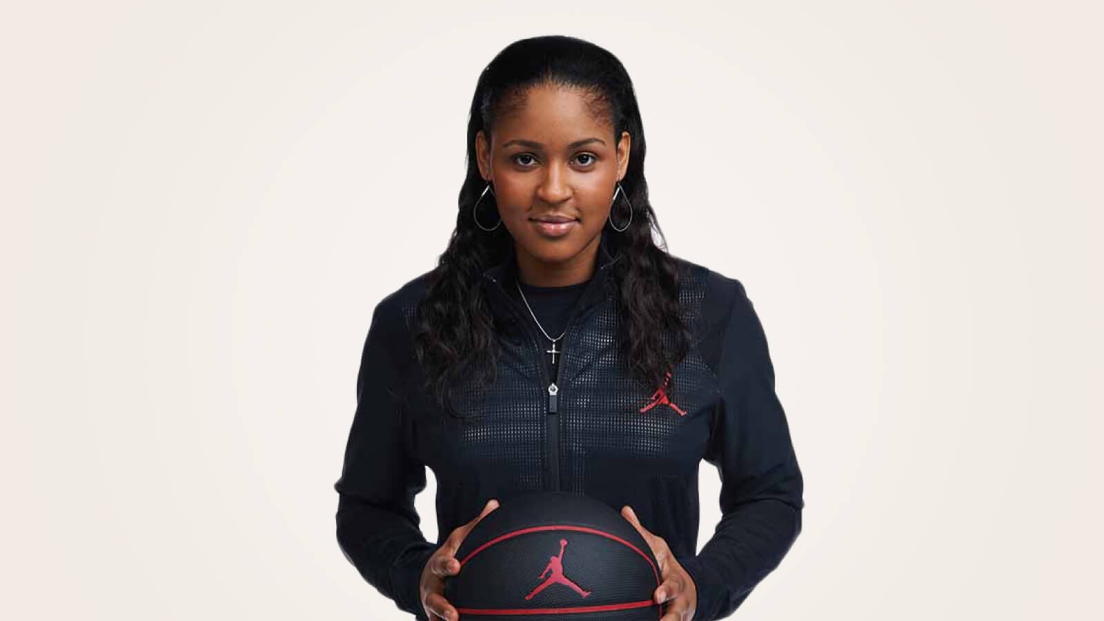 A portrait of Maya Moore holding a basketball