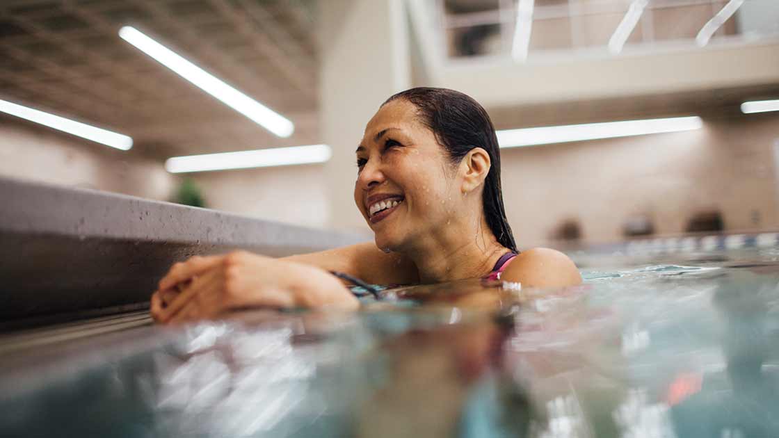 A smiling woman in a pool