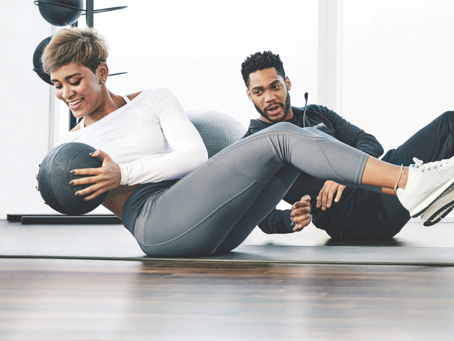 Woman working with her trainer