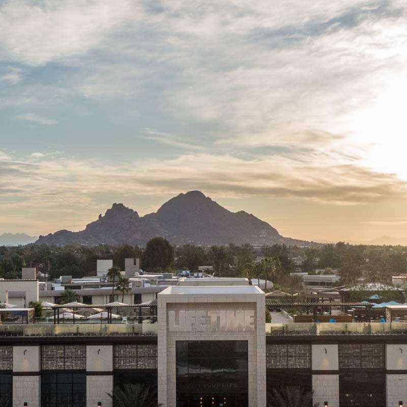 The rooftop view of Life Time Biltmore and the Arizona landscape and sky in the background