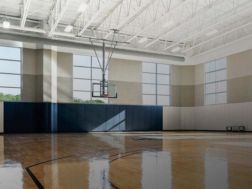 a well lit basketbal court with gleaming floors