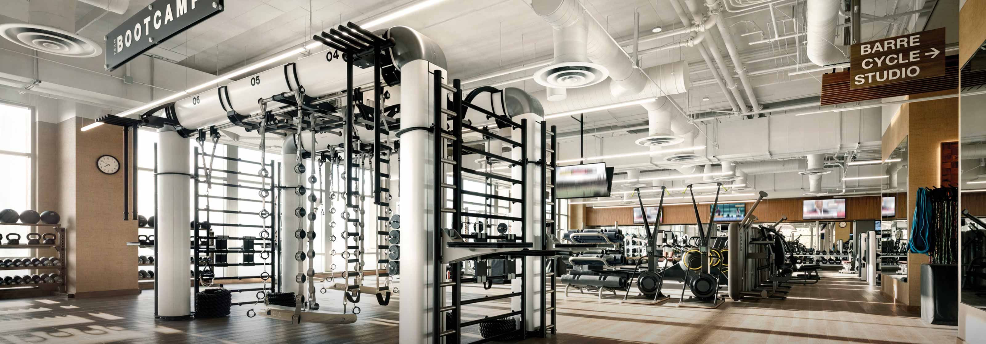 a vast fitness and workout area with weight and cardio machines