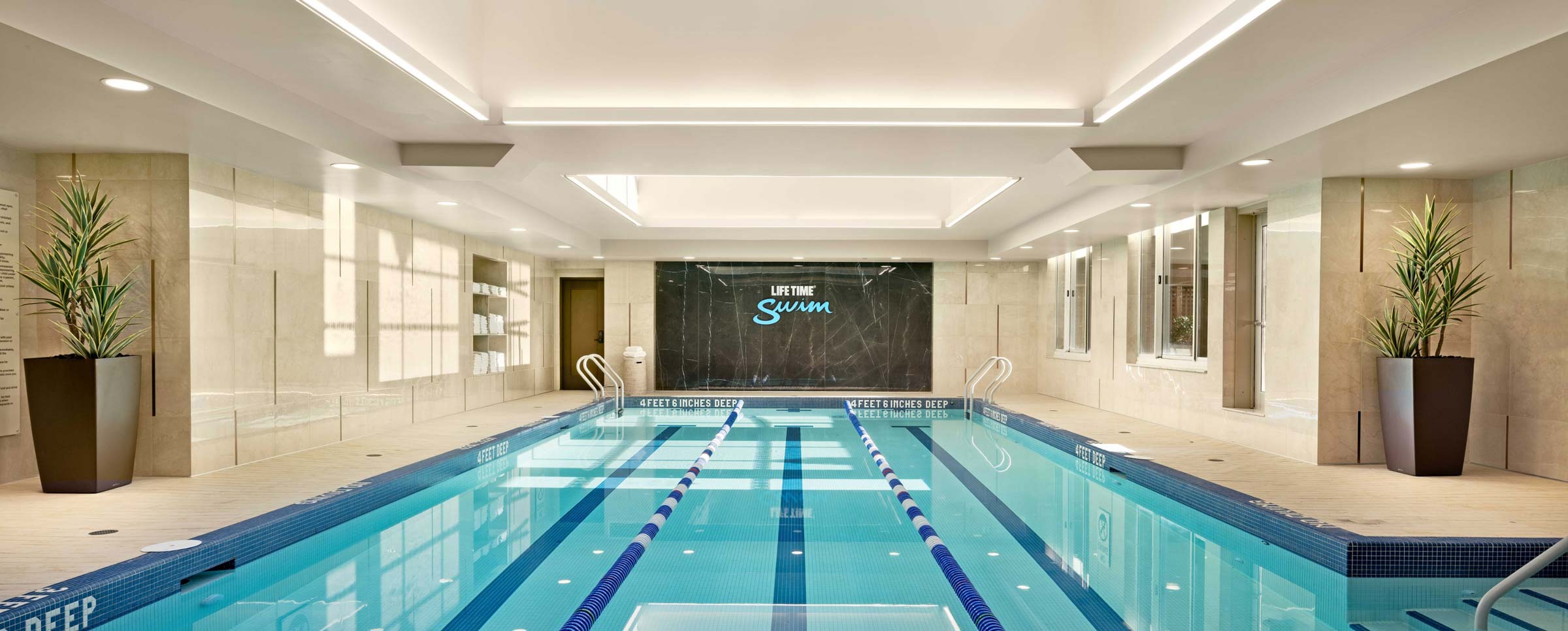 a 3 lane indoor lap pool with lane lines