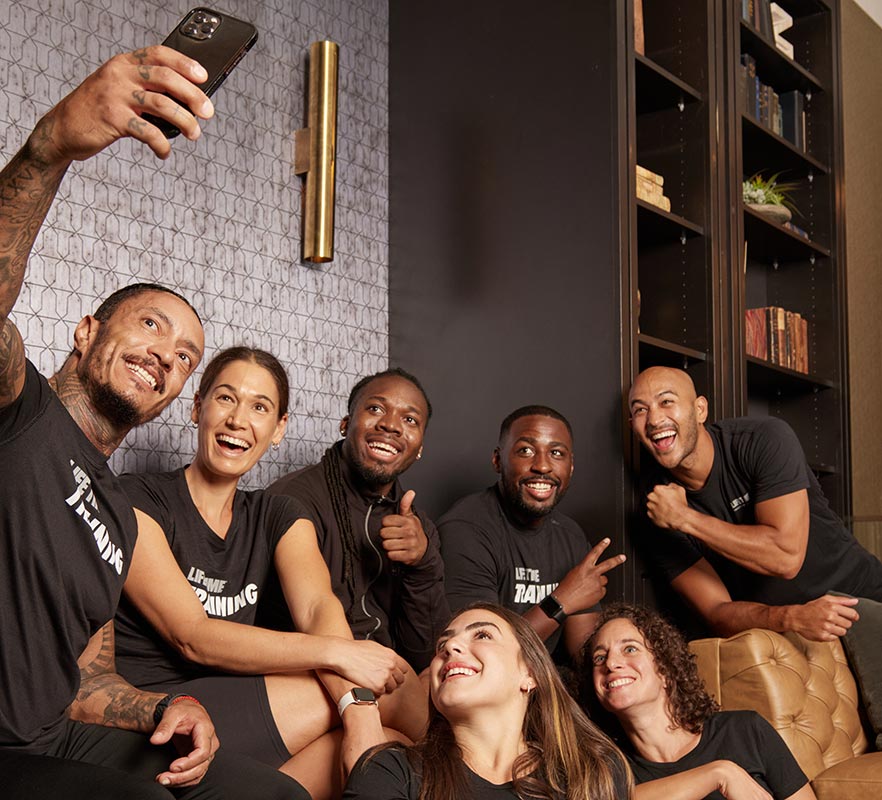 a group of life time performers group together for a selfie