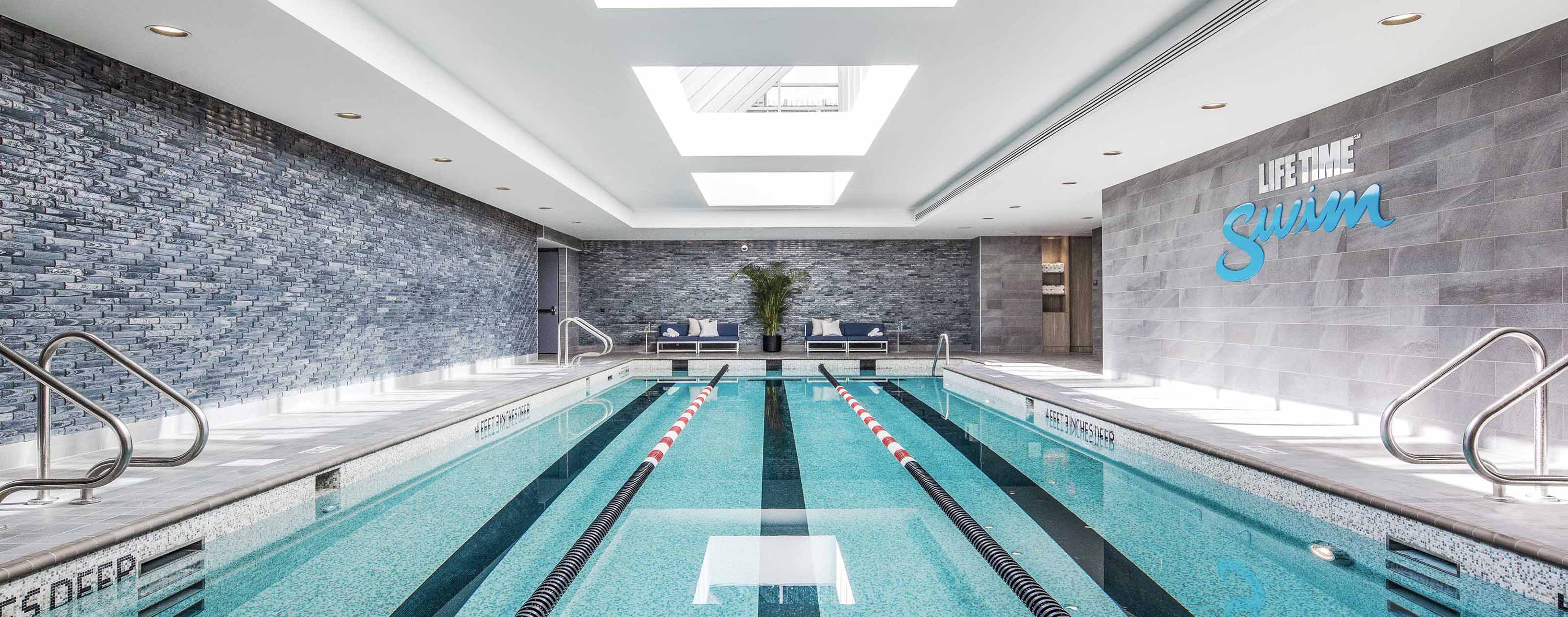 a 3 lane indoor lap pool with sky lights