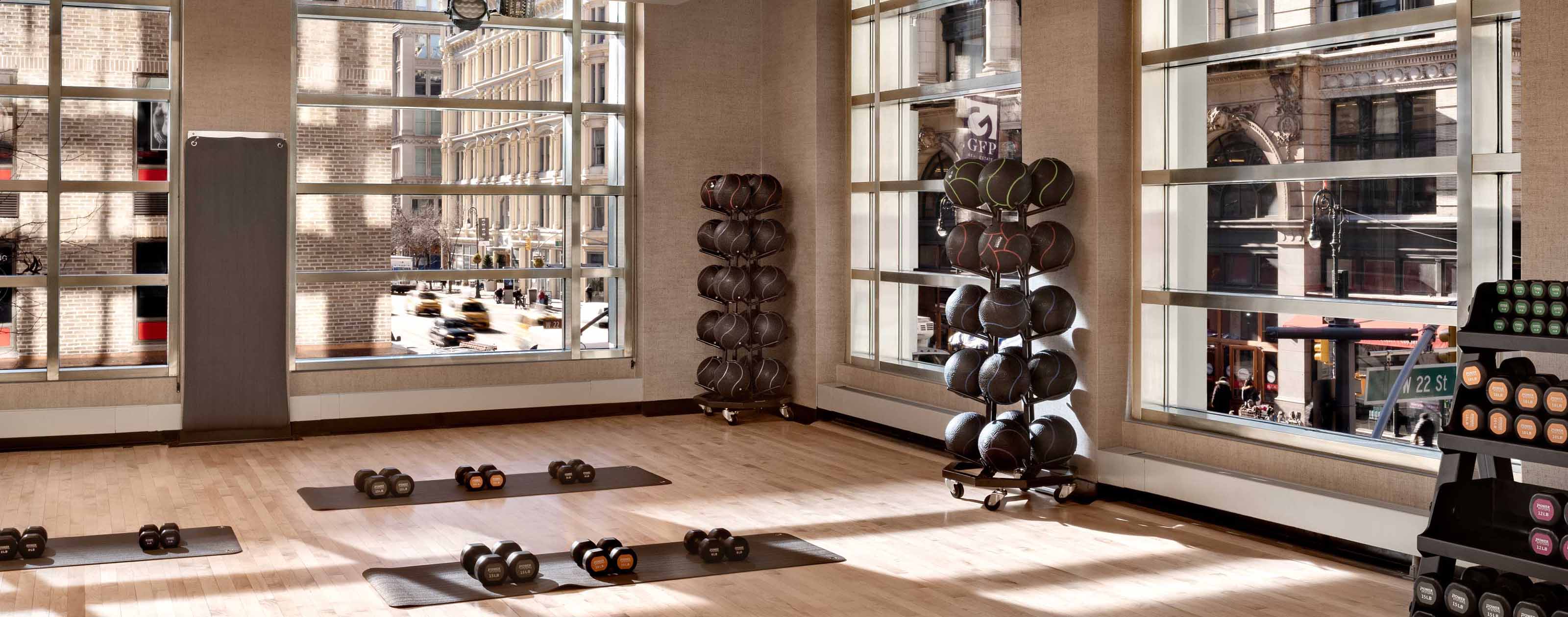 dumbells and medicine balls in a workout area