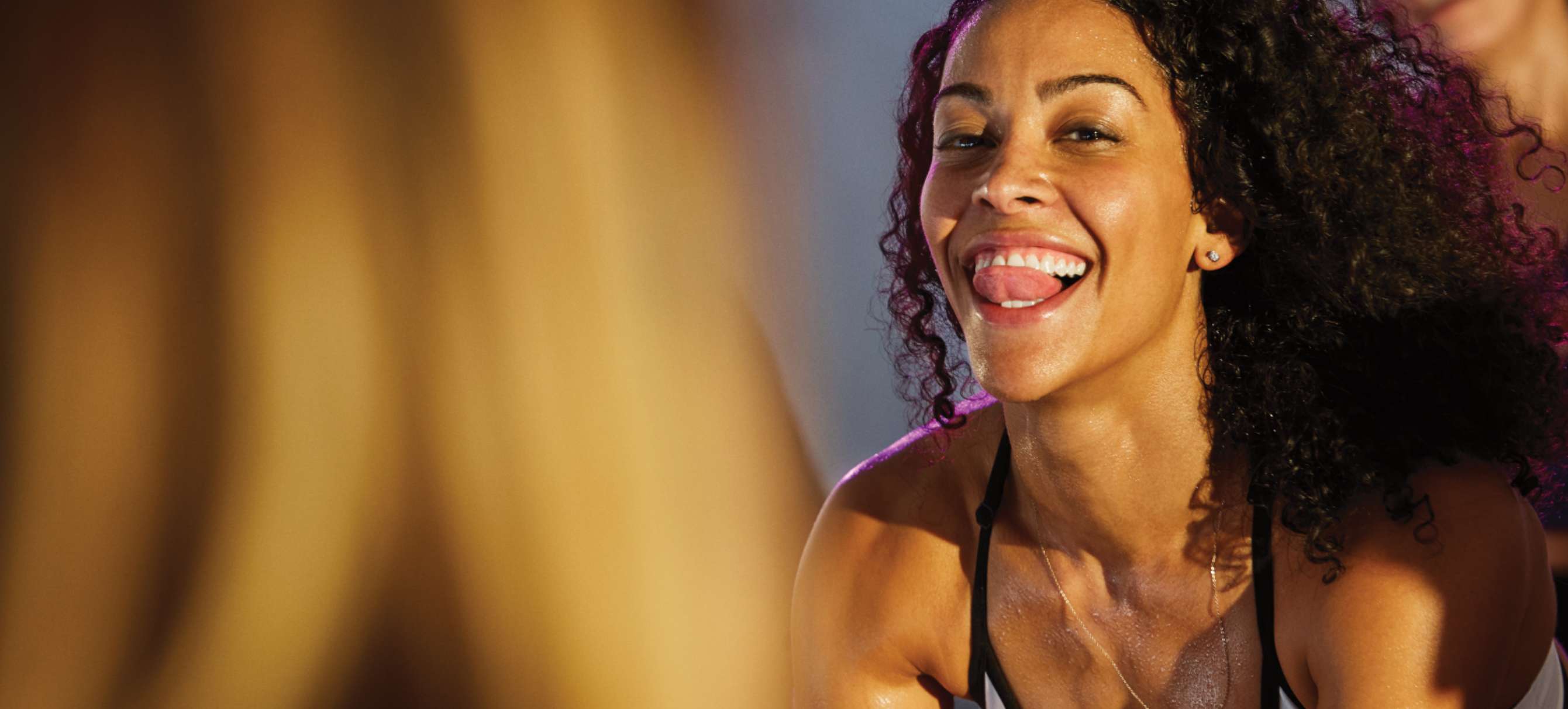 woman smiling while working out