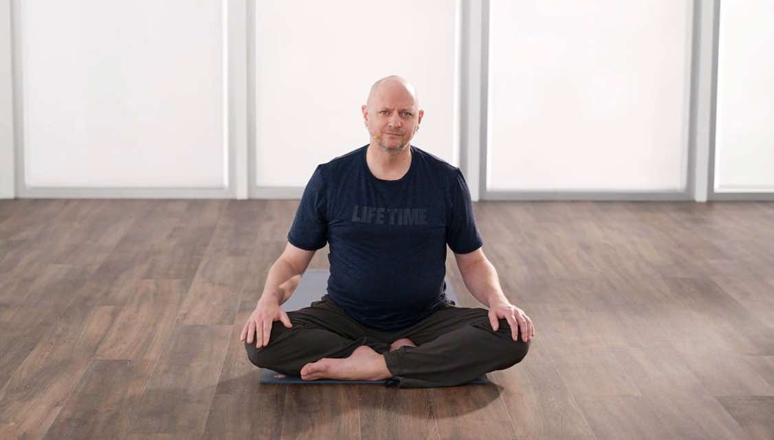 Man in a seated yoga pose