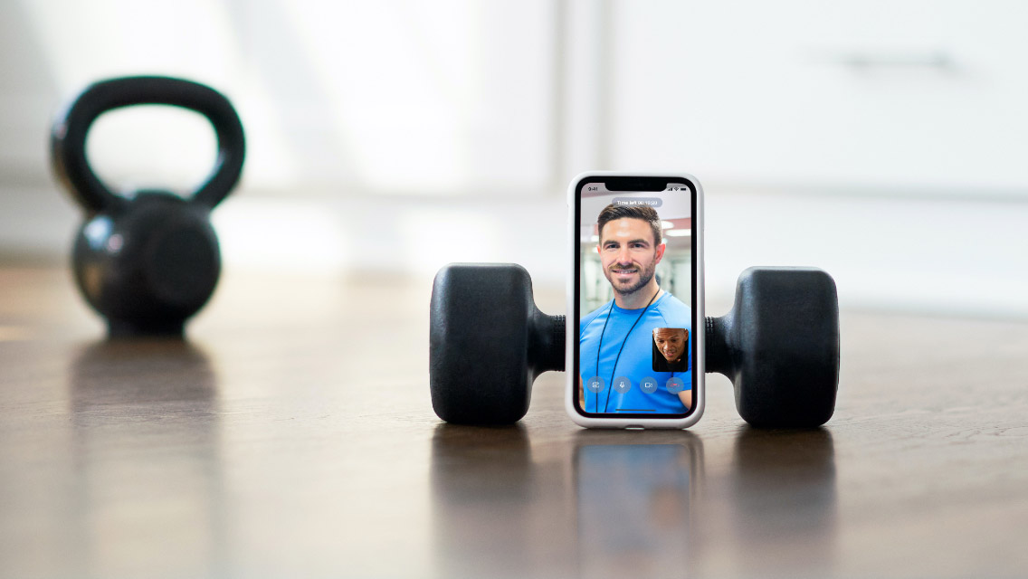Close-up of a phone screen showing the Life Time Virtual App Trainer during a workout session