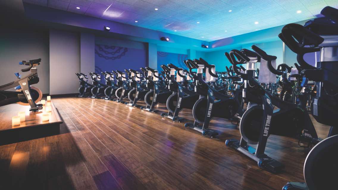 rows of cyling bikes inside a studio