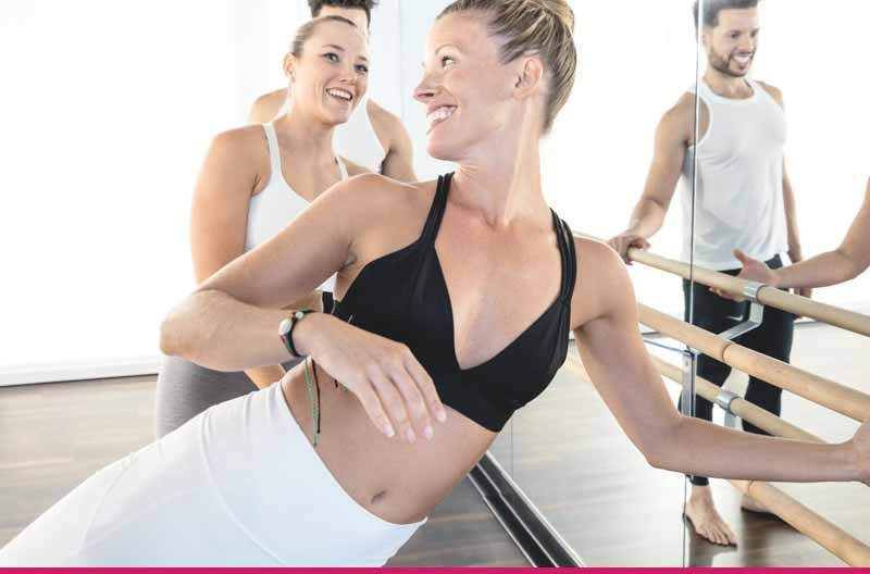 Two woman smiling and stretching