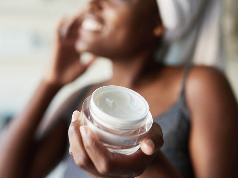 woman using a face cream